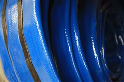 Click to enlarge - Extremely robust layflat hose designed for the most arduous conditions found in off-shore and bunkering applications.
Made from a very tough PU material and reinforced with high tensile polyester fibres, this hose is well suited to difficult working conditions. The hose can be fitted with two earthing wires contained within the black strap.